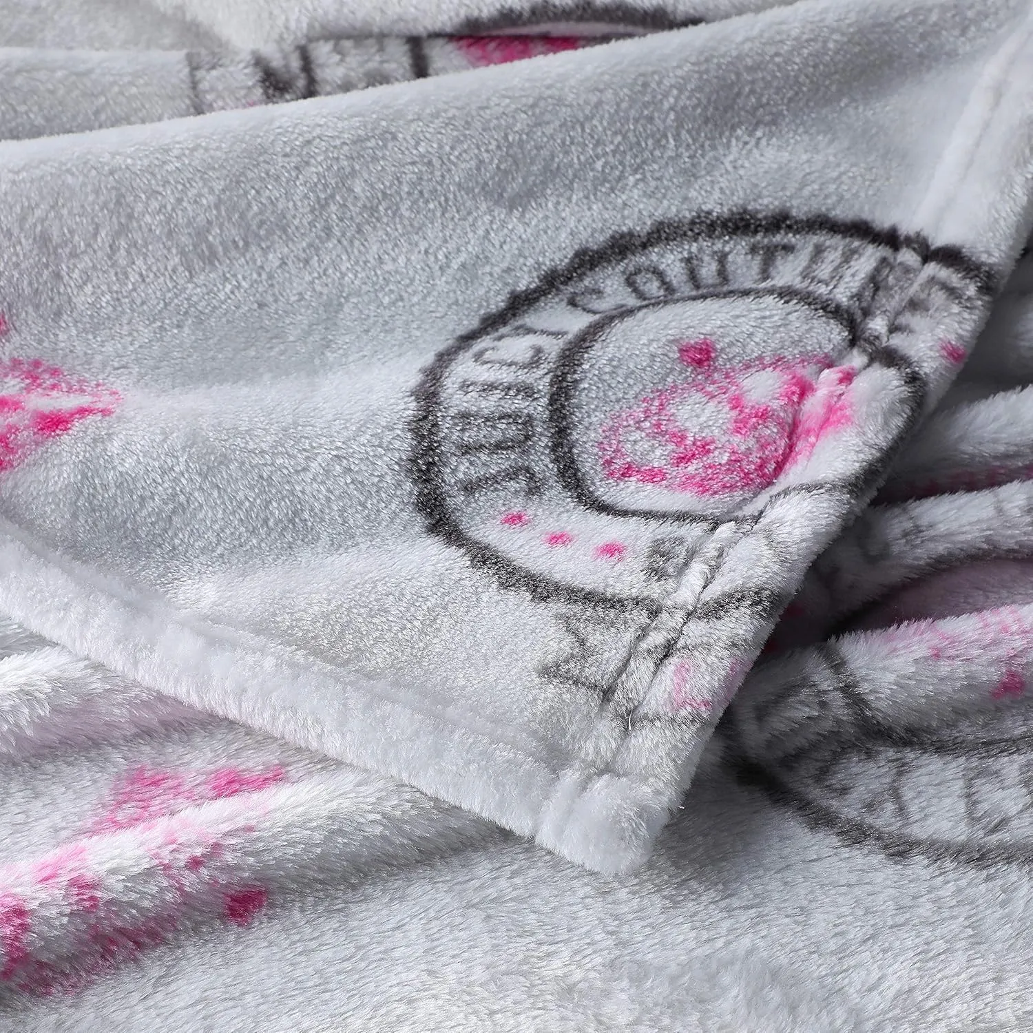 Juicy Couture – Throw Blanket | Juicy Emblem | Plush and Cozy | Decorative Blankets for Sofas, Chairs and Beds| Luxurious and Soft | Chic Home Décor | Measures 50” x 70” | Pink/Black/White