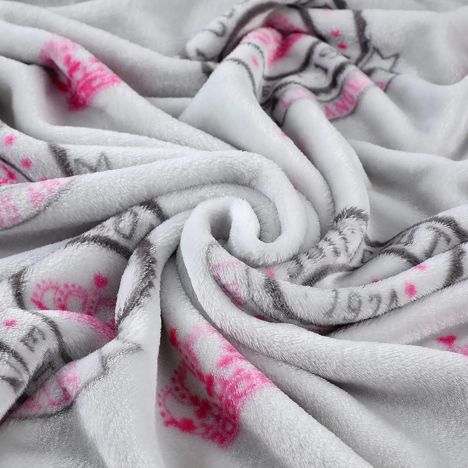 Juicy Couture – Throw Blanket | Juicy Emblem | Plush and Cozy | Decorative Blankets for Sofas, Chairs and Beds| Luxurious and Soft | Chic Home Décor | Measures 50” x 70” | Pink/Black/White