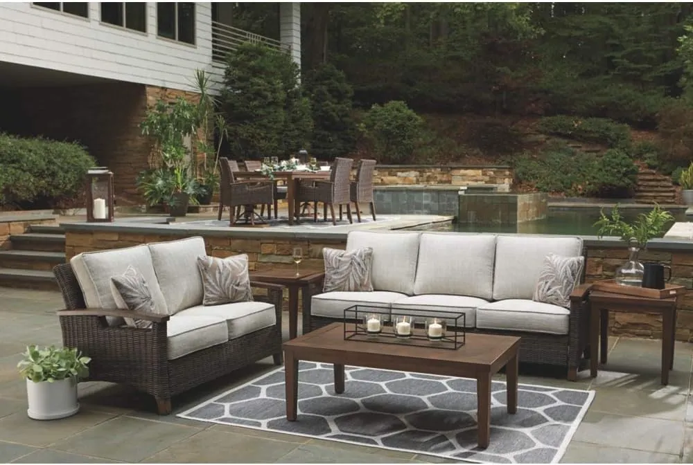 Signature Design by Ashley Paradise Trail Outdoor Loveseat with All Weather Cushions, Medium Brown