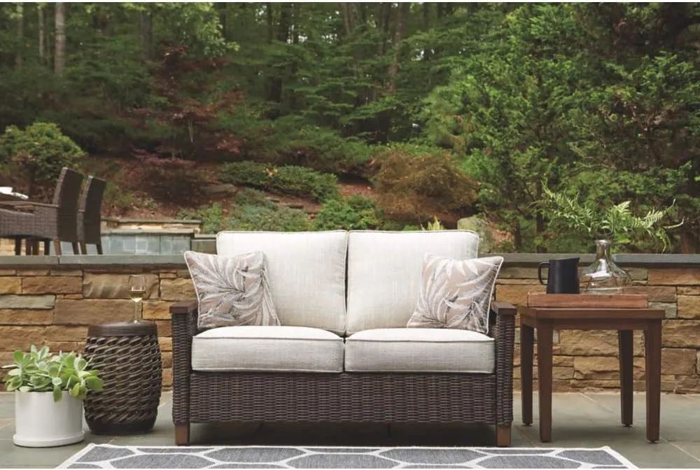 Signature Design by Ashley Paradise Trail Outdoor Loveseat with All Weather Cushions, Medium Brown