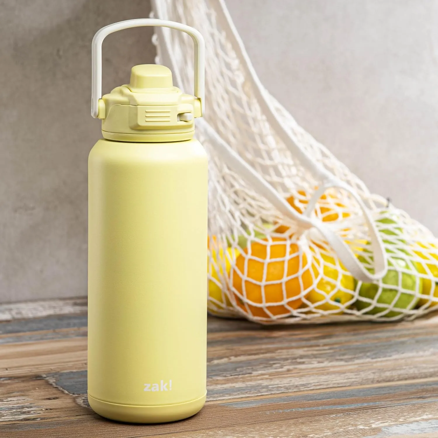 Zak Designs Beacon Straw Lid Water Bottle for Travel or At Home, 32oz Stainless Steel is Leak-Proof and Vacuum Insulated with Silicone Spout, Cover, Carry Handle, Protective Base (Vanilla Yellow)